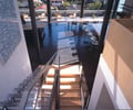 Preview of Tobias Residence - Image 4: Airport Terminal, Terminal, Dining Table, Furniture, Table, stair, plexiglass, structure steel, view.