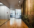 Preview of Undead Labs - Image 11: open floor plan, natural light, glass walls, pivot door, wood flooring, modern lighting, conference area, contemporary, texture, mural, transparency, commercial space, interior design.