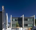 Preview of West Newton Flats - Image 3: Flora, Jar, Plant, Potted Plant, Pottery, Vase, Architecture, Building, Convention Center, Office Building.