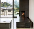Preview of West Newton Penthouse - Image 1: Flooring, Molding, Indoors, Interior Design, fireplace, decopour floor, steel black, blackened steel, wood ceiling, sliding glass door.