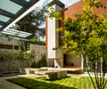 Preview of Windermere Residence - Image 18: Bonsai, Flora, Jar, Plant, Potted Plant, Pottery, Tree, Vase, Vine, Building, Office Building, Patio, Pergola, Porch, fireplace, structure concrete, glass exterior, concrete floor.
