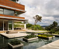 Preview of Windermere Residence - Image 1: Patio, Bonsai, corten, water feature, House, Yard, Waterfront, Corten, Window, Glass, Concrete, Outdoors.