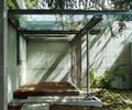 Preview of Windermere Residence - Image 10: Patio, Pergola, Porch, Flora, Ivy, Plant, structure steel, glass exterior, structure concrete, concrete wall, paver, moss, canopy.