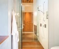 Preview of Windermere Residence - Image 14: Indoors, Interior Design, shower, bathroom, glass door, wood floor, concrete floor, wood ceiling.