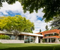 Preview of Windermere Residence - Image 15: Building, House, Housing, steel frame, Cottage, Flora, Plant, Tree, Conifer, Yew, corten, glass exterior, planter, grass.