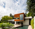 Preview of Windermere Residence - Image 16: Building, Office Building, Conifer, Flora, Plant, Tree, Yew, Apartment Building, City, High Rise, Town, Urban, Housing, Arecaceae, Palm Tree, pool, corten, ivy, indoor outdoor.