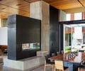 Preview of Windermere Residence - Image 17: Dining Table, Furniture, Table, Indoors, Interior Design, Flora, Plant, Potted Plant, Dining Room, Room, steel black, concrete floor, wood ceiling.