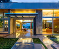 Preview of Windermere Residence - Image 20: Building, House, Steel frame, Villa, Flora, Plant, Tree, indoor outdoor, moss, lighting, water feature, concrete floor, structure concrete, canopy, planter.