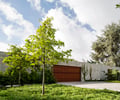Preview of Windermere Residence - Image 21: Conifer, Flora, Plant, Tree, Yew, Fence, Hedge, Bench, planting, concrete wall, ipe, garage door.