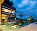 Preview of Windermere Residence - Image 3: Flora, lighting, water feature, planting, sun screen, Steel , Corten, Outdoors, Water Feature, Yard, Patio, Glass, Glass Door, Waterfront, House.