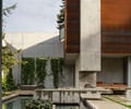 Preview of Windermere Residence - Image 5: Flora, Plant, Planter, Potted Plant, water feature, ivy, fireplace, concrete, corten, Fireplace.