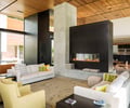 Preview of Windermere Residence - Image 8: Great room, Fireplace, Hearth, Couch, Furniture, Indoors, Interior Design, wood ceiling, Glass, Wood, Steel, Concrete, Pillar, Window, Corten.