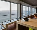 Preview of Zillow Executive Offices - Image 0: Furniture, Indoors, water feature, view, concrete, concrete counter, wood floor, grating.