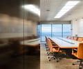 Preview of Zillow Executive Offices - Image 13: Chair, Furniture, Conference Room, Indoors, Meeting Room, Room, Dining Table, Table, steel wall, steel black, lighting, leather, grating.