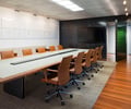 Preview of Zillow Executive Offices - Image 14: Conference Room, Indoors, Meeting Room, Room, Chair, Furniture, Dining Table, Table, Plywood, Wood, grating, wood floor, leather.