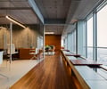 Preview of Zillow Executive Offices - Image 4: Chair, Furniture, Hardwood, Wood, Flooring, Indoors, Interior Design, wood floor , water feature , lighting.