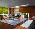 Preview of Zillow Executive Offices - Image 7: Chair, Furniture, Conference Room, Indoors, Meeting Room, Room, Dining Table, Table, Interior Design, wood floor , water feature , green wall , wood wall , lighting , great room, lounge, water feature, bench, green wall, kitchen, concrete counter.