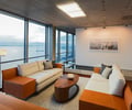 Preview of Zillow Executive Offices - Image 8: Furniture, Indoors, Room, Interior Design, Apartment, Building, Housing, lighting , office, water feature, paver, lighting, wood floor.