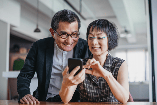 Older couple looking at a phone