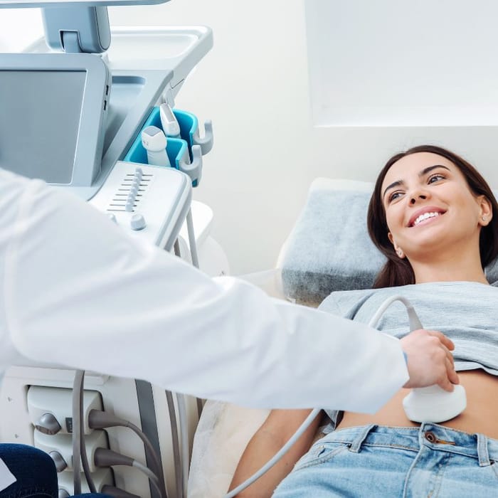 Patient smiling during an ultrasound scan