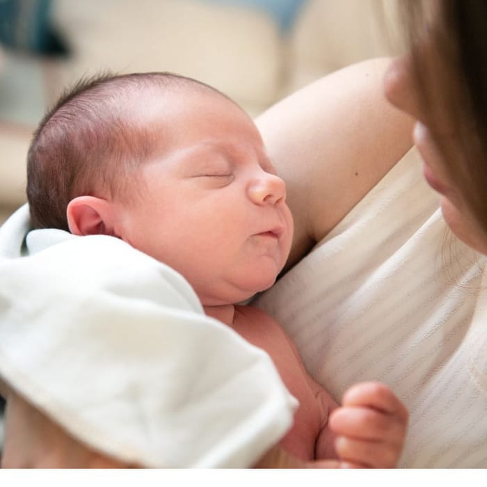 Mother holding her newborn baby