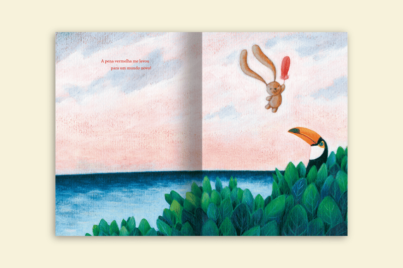 tito e a amazonia coelho voando segurando pena vermelha editora via ludica