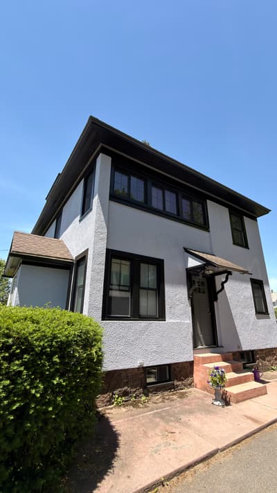Lavender Stucco Home Exterior, Greenfield MA after - exterior painting Springfield MA