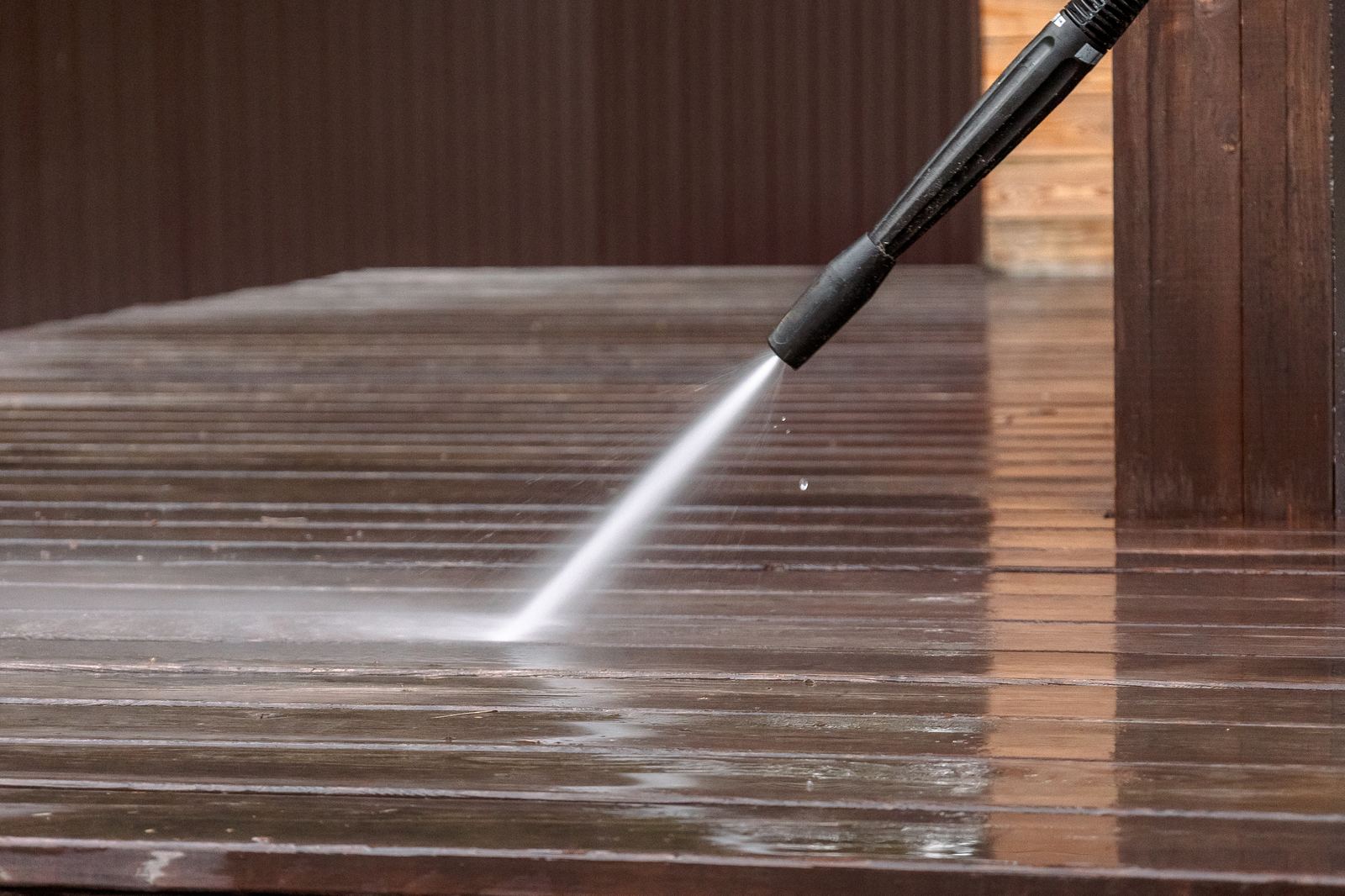 Soft washing a home exterior in Western Massachusetts to remove mold and algae without damaging siding