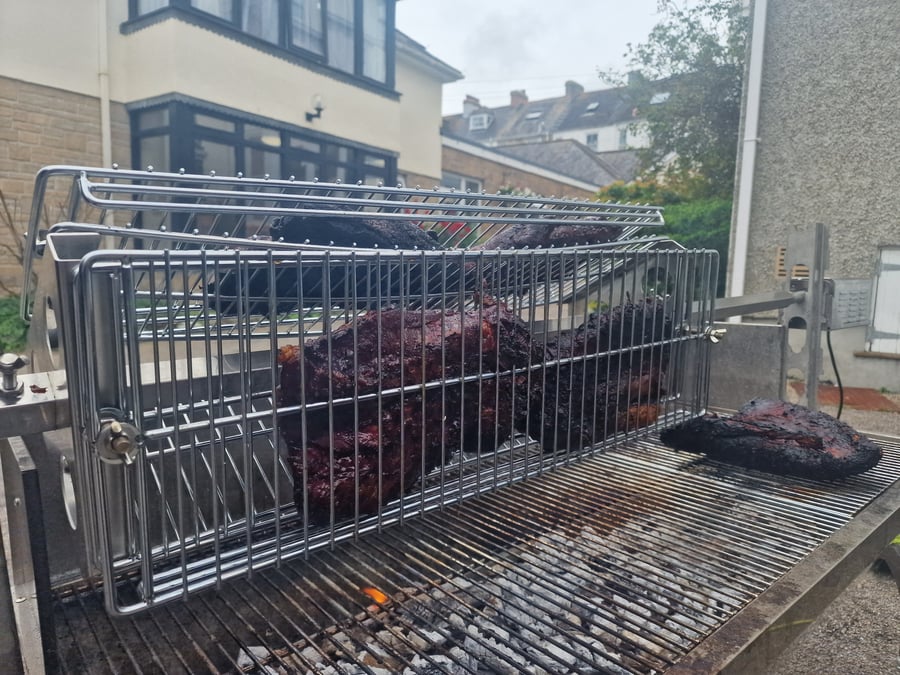 Succulent cuts of meat are slow-cooked on a rotisserie over hot coals, promising tender, smoky flavour for any event