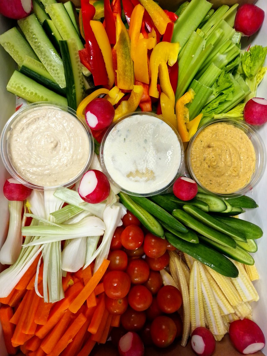 A vibrant platter of fresh crudités and dips, perfect for any event