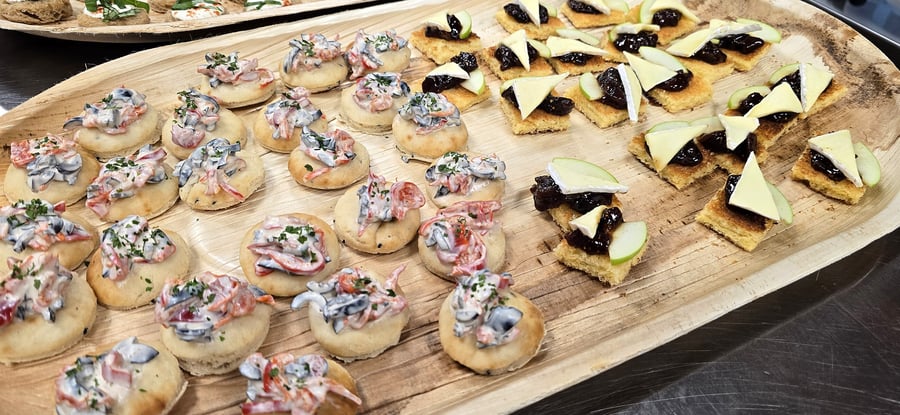 Assortment of canapés including creamy mushroom and pepper bites and cheese and chutney squares