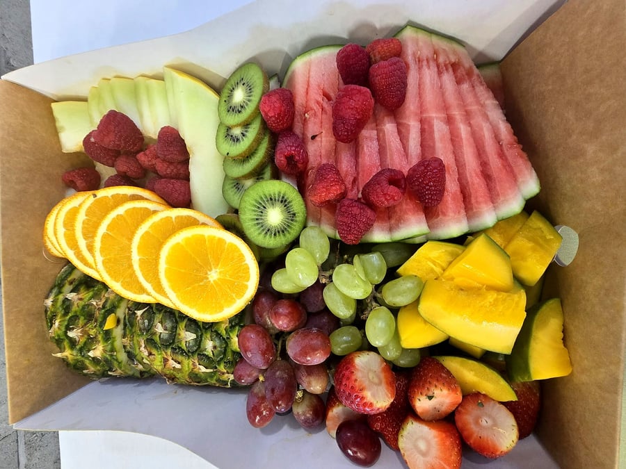 A vibrant platter overflowing with a variety of fresh, colourful fruits