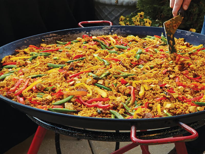 Giant paella pan being cooked at a Cornwall event