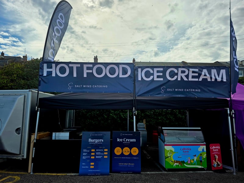 The scoop cabinet and menu boards on our stand, with the hot food gazebo alongside