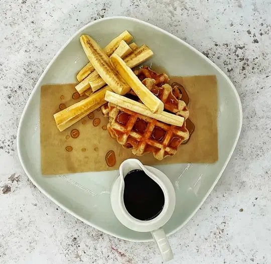 American Style Waffles served with Banana & Maple Syrup