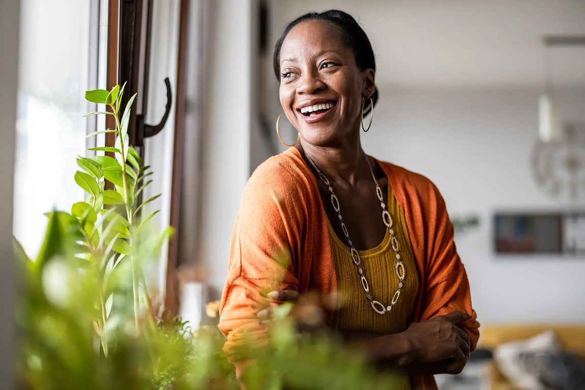 Smiling woman in an orange top