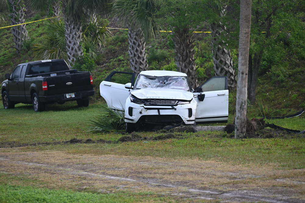 The suspect's vehicle at the foot of an embankment on the west side of the Hammock Dunes Bridge. (© FlaglerLive)