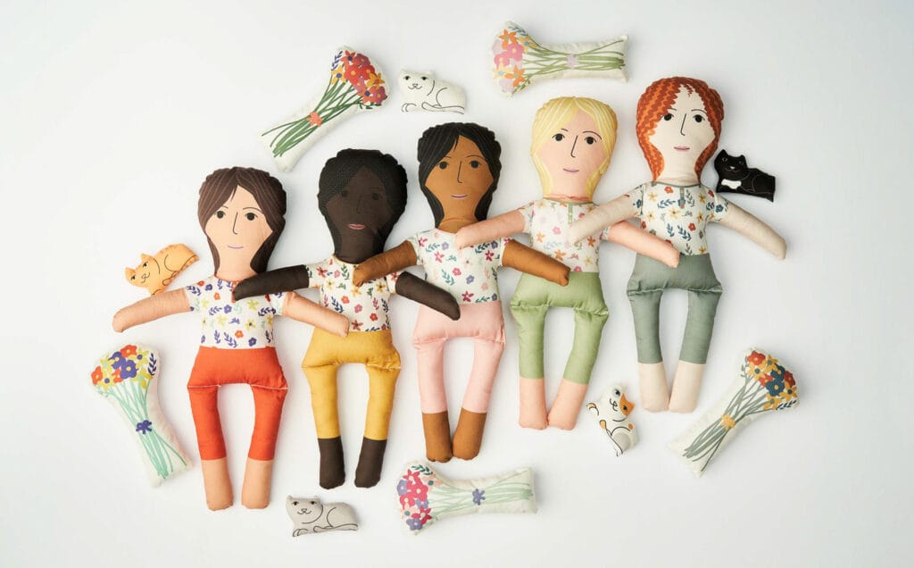 A whole set of fabric dolls made from cut and sew kits with 100% organic cotton
