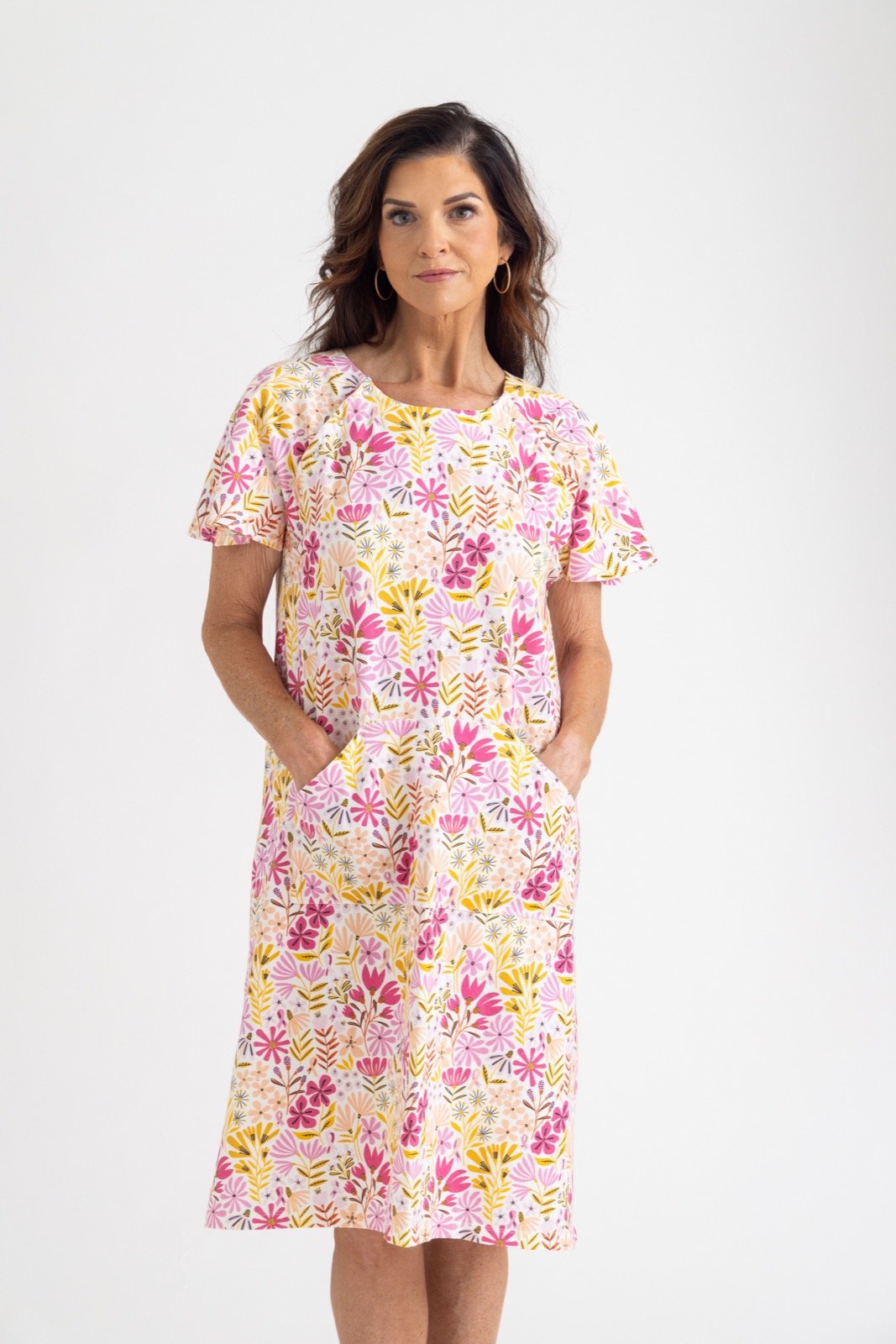 An older lady wearing a pink and yellow floral patient gown from untethered