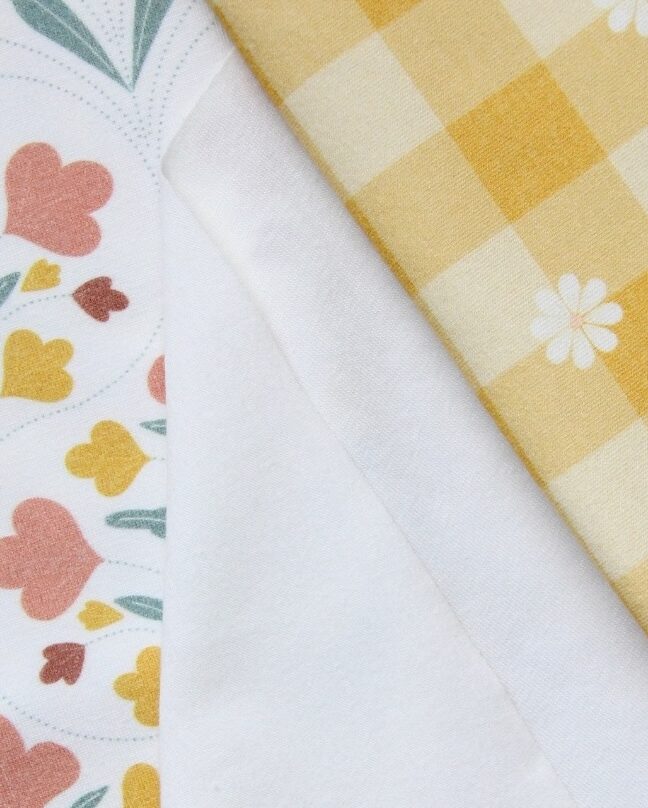 Organic cotton spandex fabrics with printed designs and the white base to show the knit fabric texture