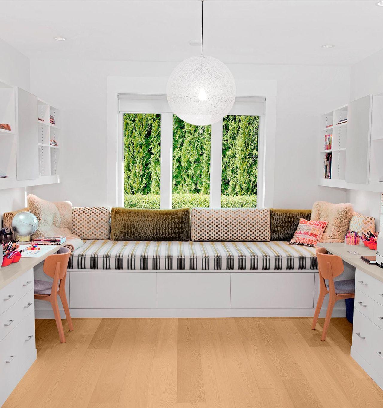 Built-in study nook with two desks, window bench, and shelving by California Closets