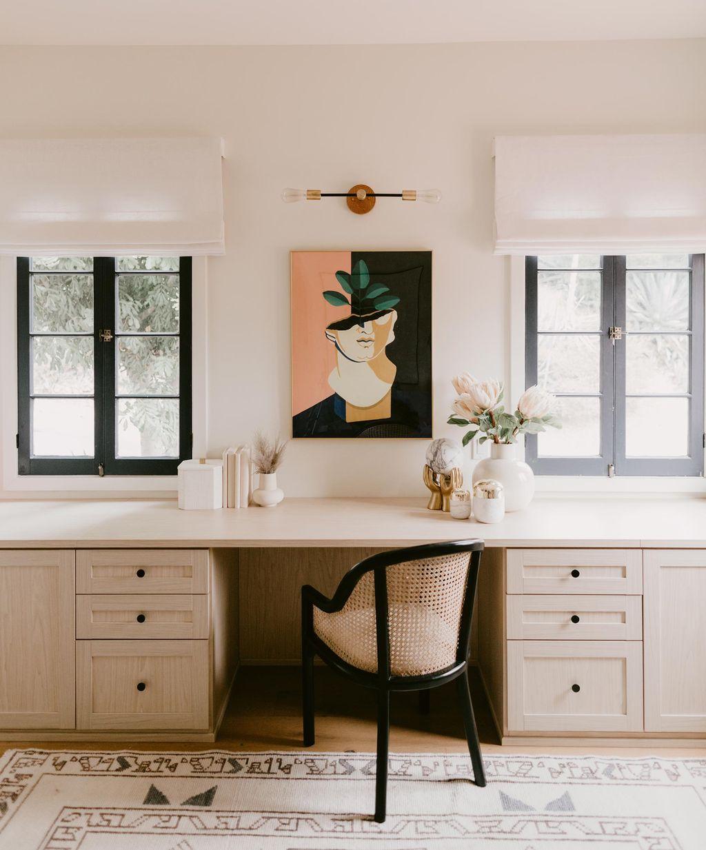 Organized work area with cabinetry and drawers from California Closets