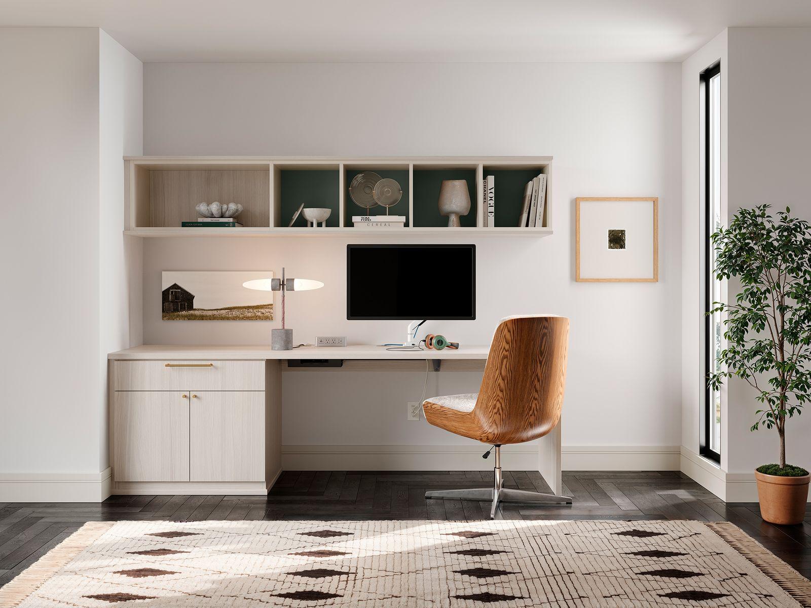 Built-in L-shaped home office with custom cabinets and workspace by California Closets