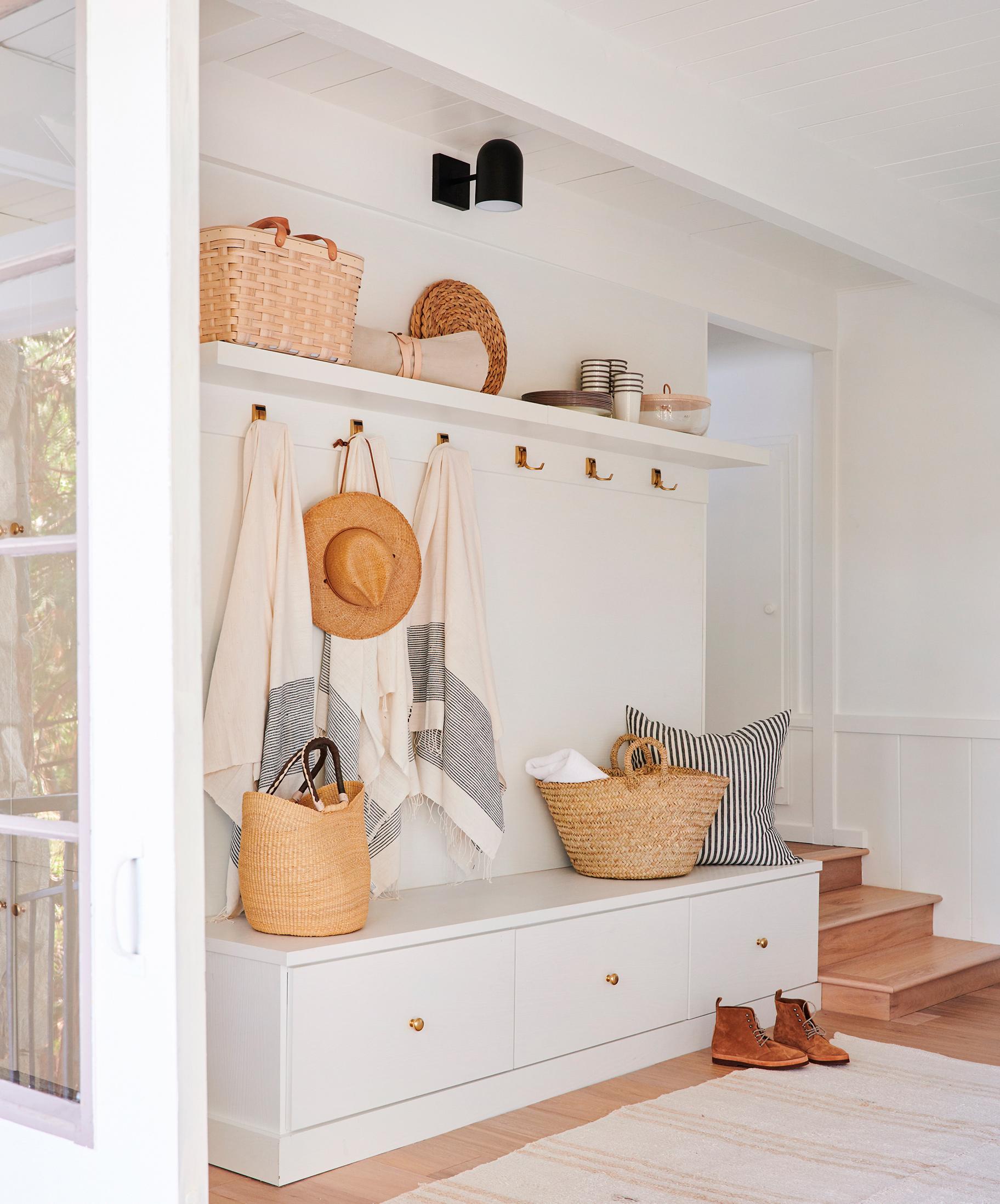 Mudroom storage design with bench seat storage and drawers designed by California Closets