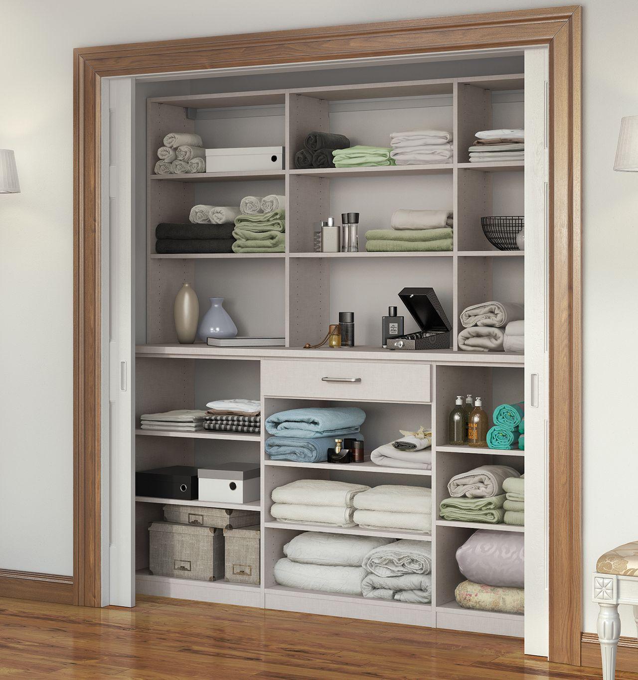 Hall linen closet shelves with custom wood grain finish by California Closets