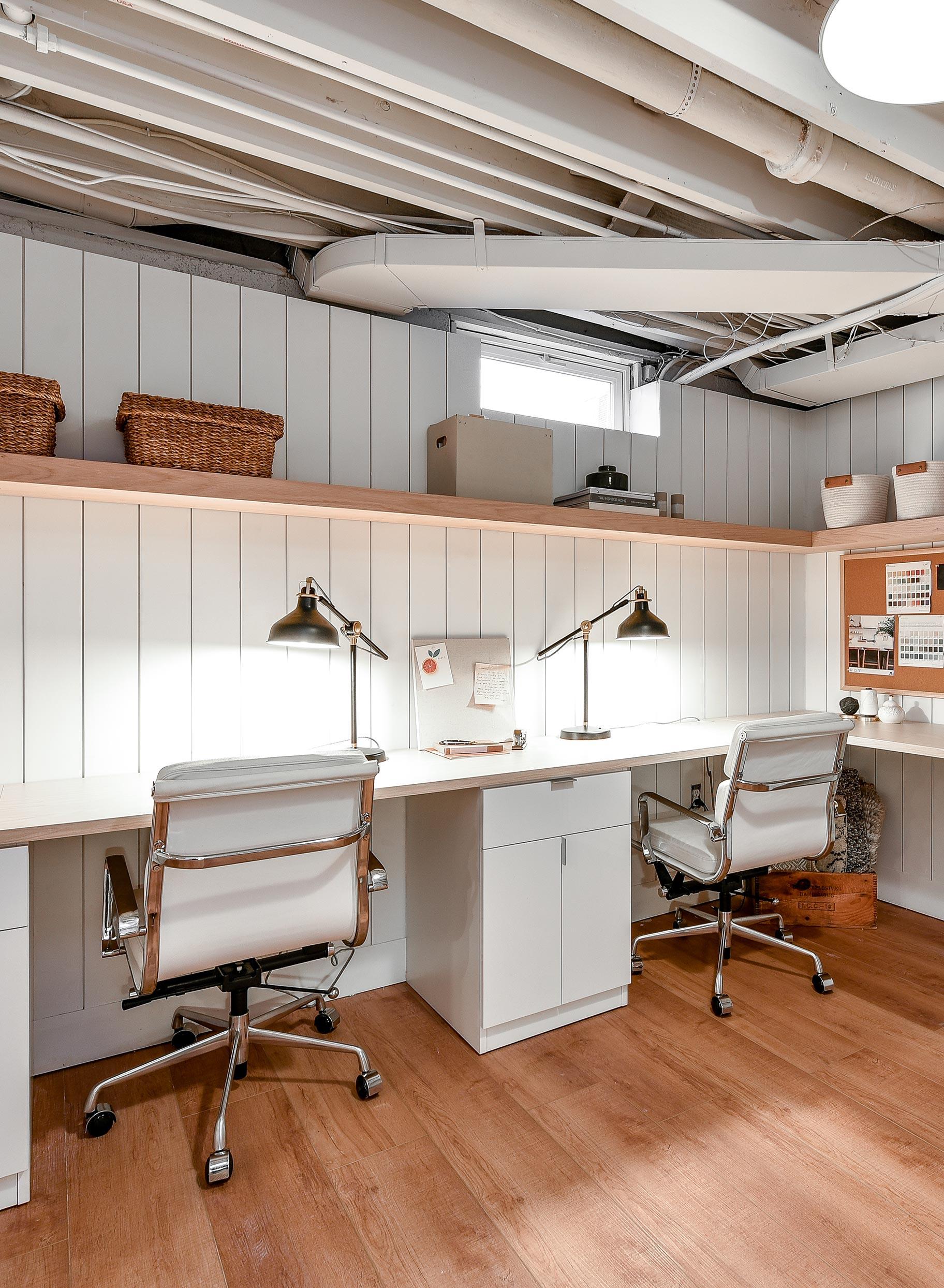 Custom home office in converted basement with coworking desks and office storage by California Closets