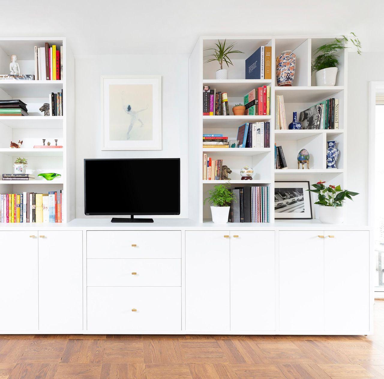 Media cabinets solution with bookshelves and drawers by California Closets
