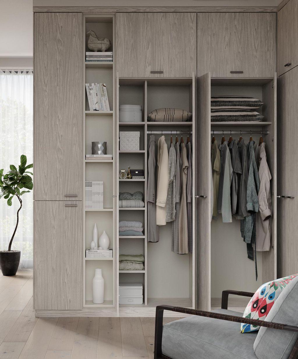 Wrap wardrobe closet with hidden storage in grey finish by California Closets