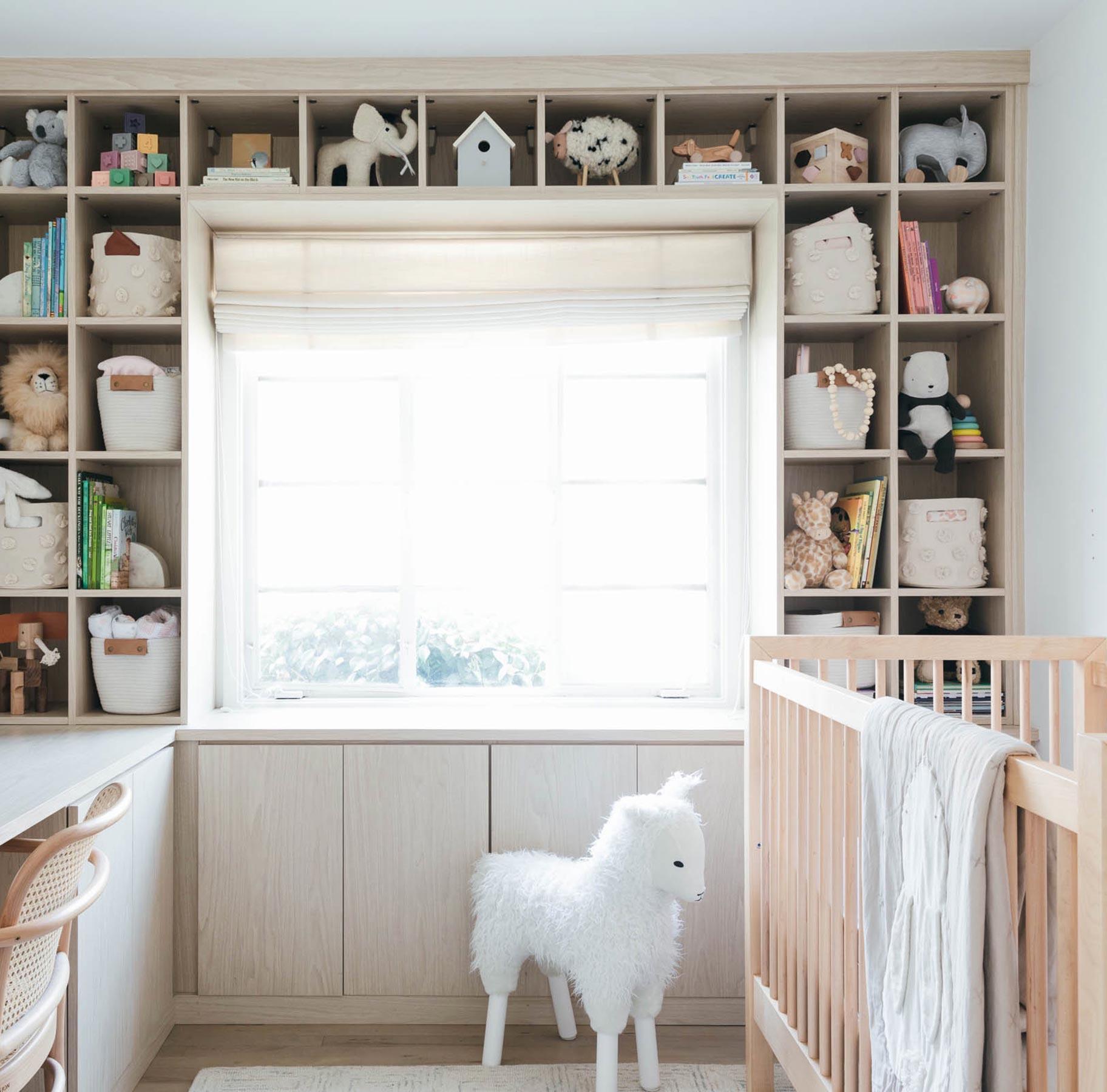 Custom nursery room with office space in a natural wood grain finish by California Closets