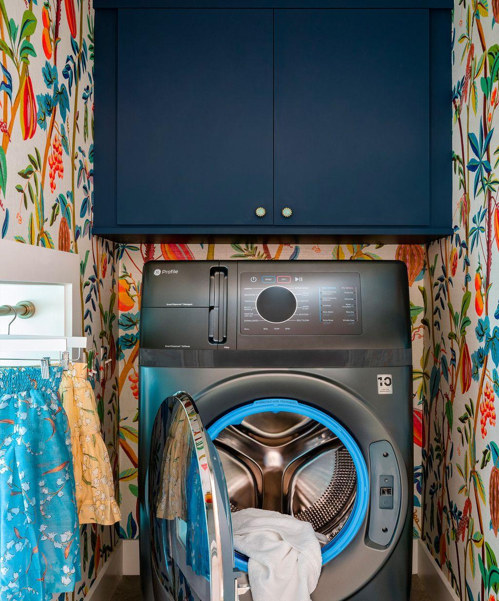 Custom small laundry room with floating cabinets by California Closets